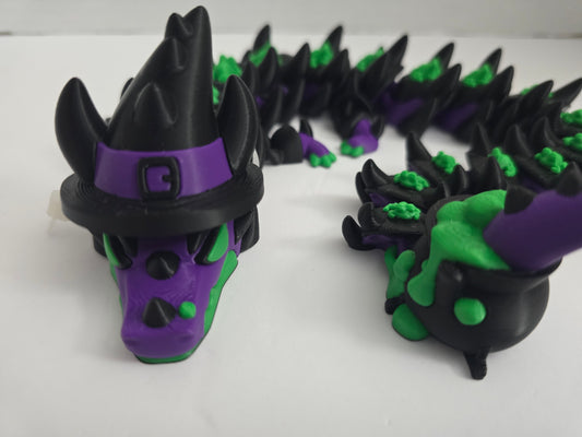 The witch dragon with a cauldron